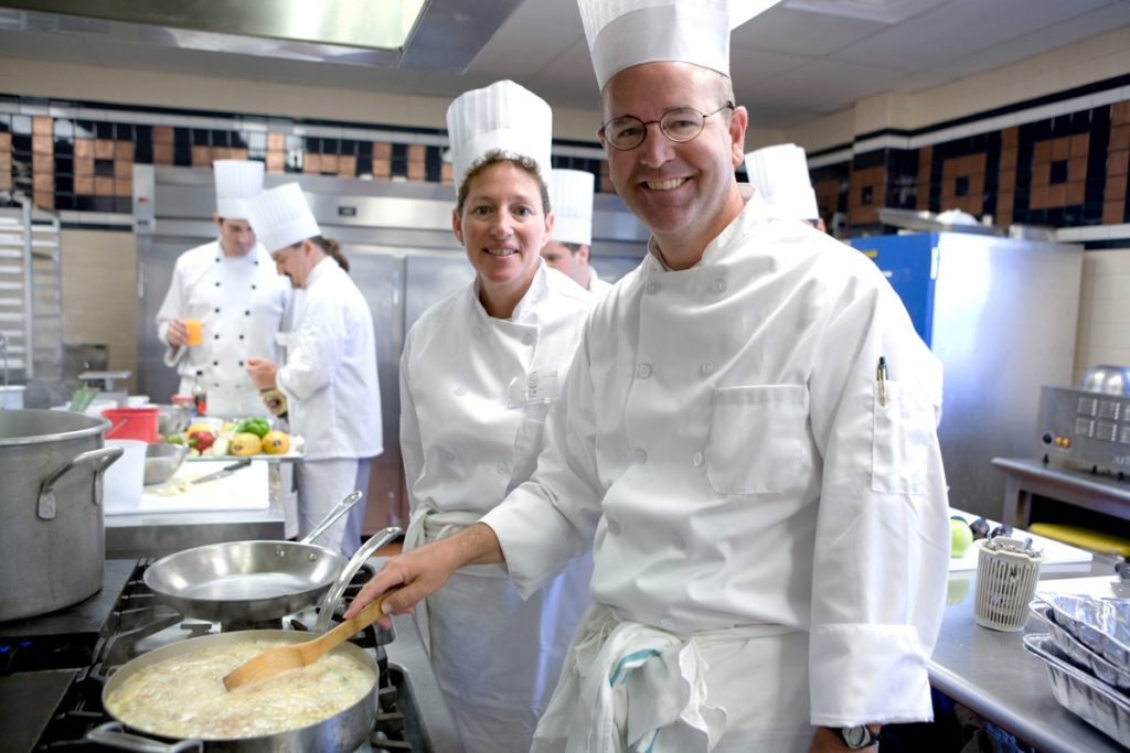 Cele and Lynn Seldon cooking at the CIA